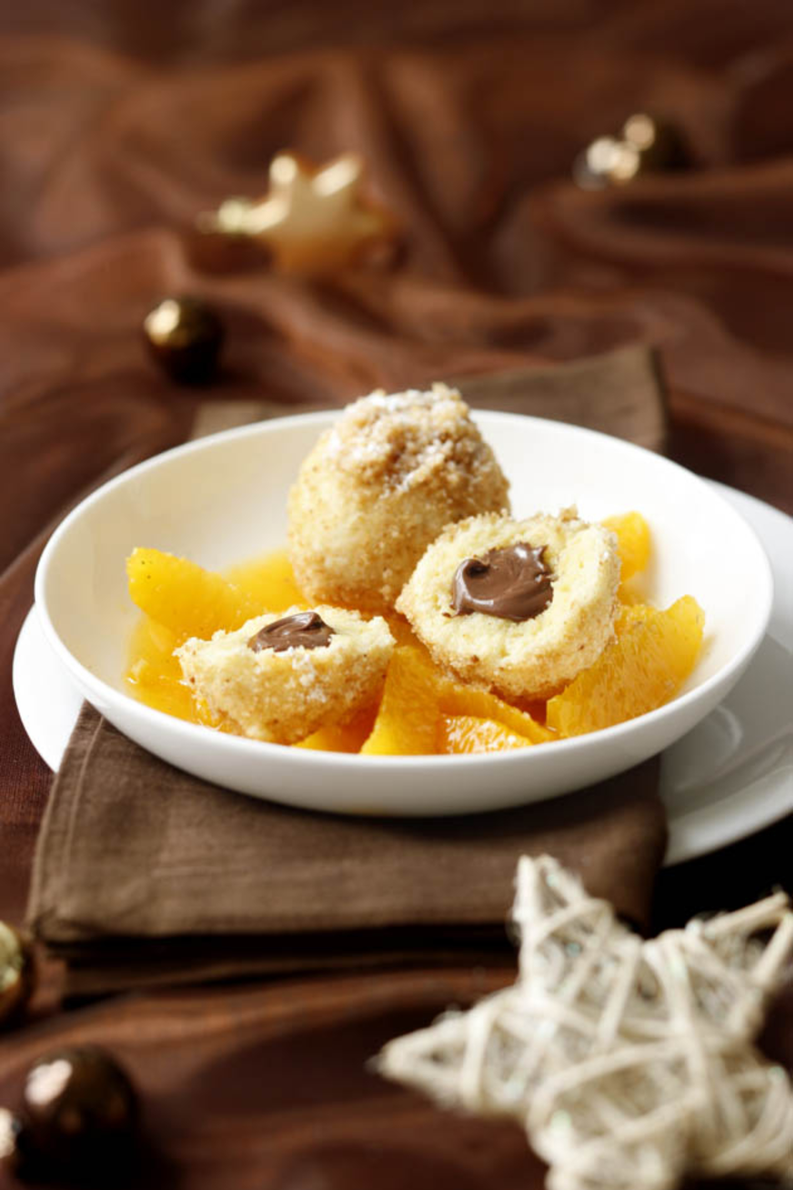 Bild zu Grießknödel mit Nougatfülle und Orangenfilets